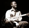 dan wilson seated with an electric guitar